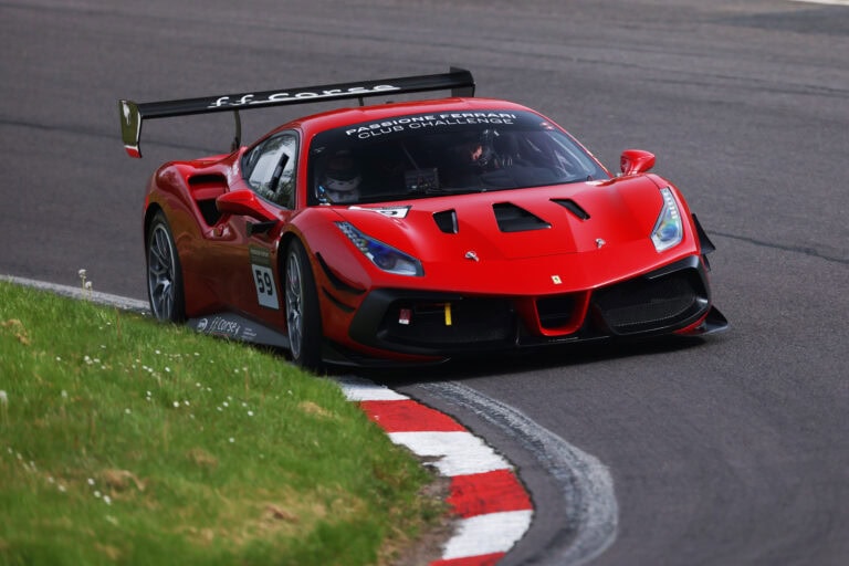 No 59 scarlet Ferrari 488 using all of the track in the Ferrari Club Challenge