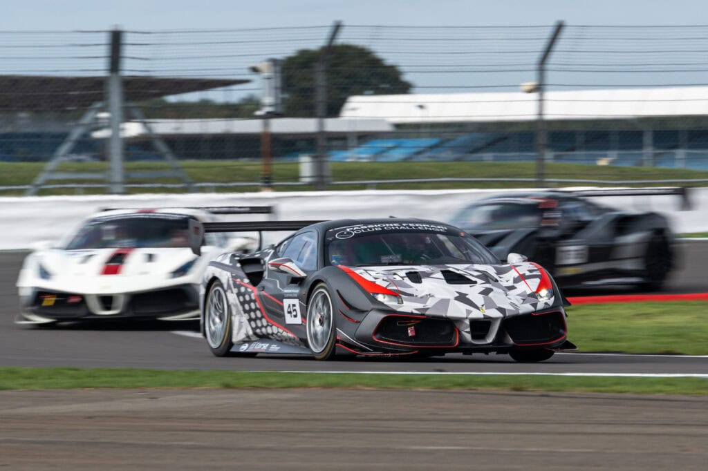 Camo Ferrari from FF Corse leads through a corner at the Ferrari Club Challenge