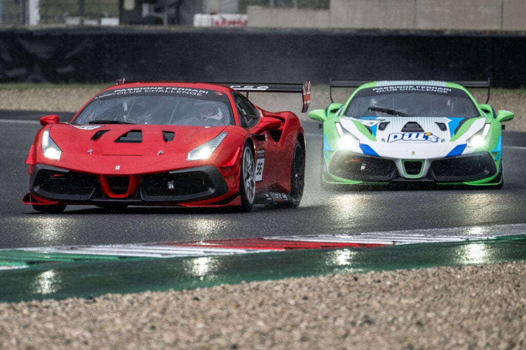 An FF Corse Ferrari Challenge Car cornering on a wet track in the Ferrari Club Challenge Europe
